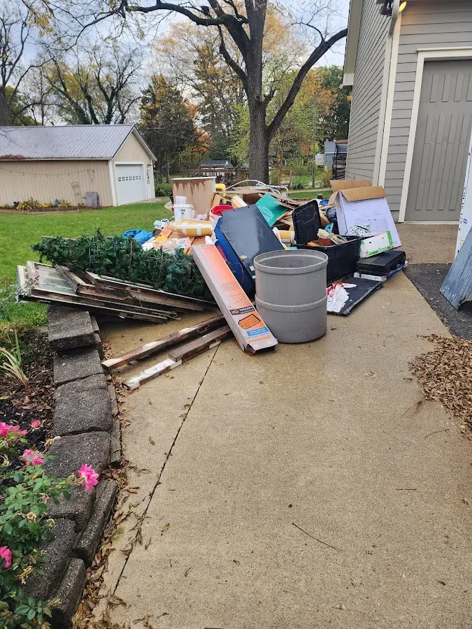 Dumpster being loaded with debris for Demolition Dumpster Rental in Trent Woods
